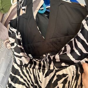 Laura Petite the brand and Medium size open back just half way. Brand new no tag